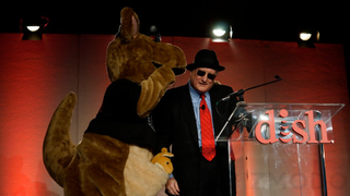Dish CEO Dresses Up, Raps and Disses the Networks